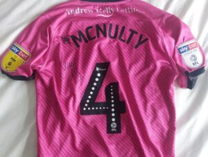 Our Promotion managers 2020-21 shirt. McNulty Signed Match Worn shirt has just taken on a new meaning